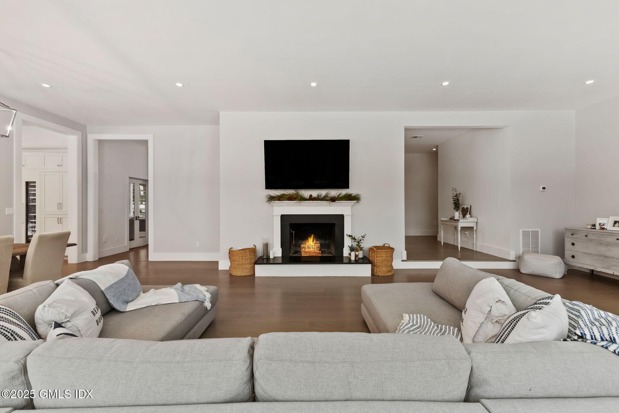 424 Taconic Road Greenwich, CT 06831 - Photo 6 of 35 a living room with furniture a flat screen tv and a fireplace
