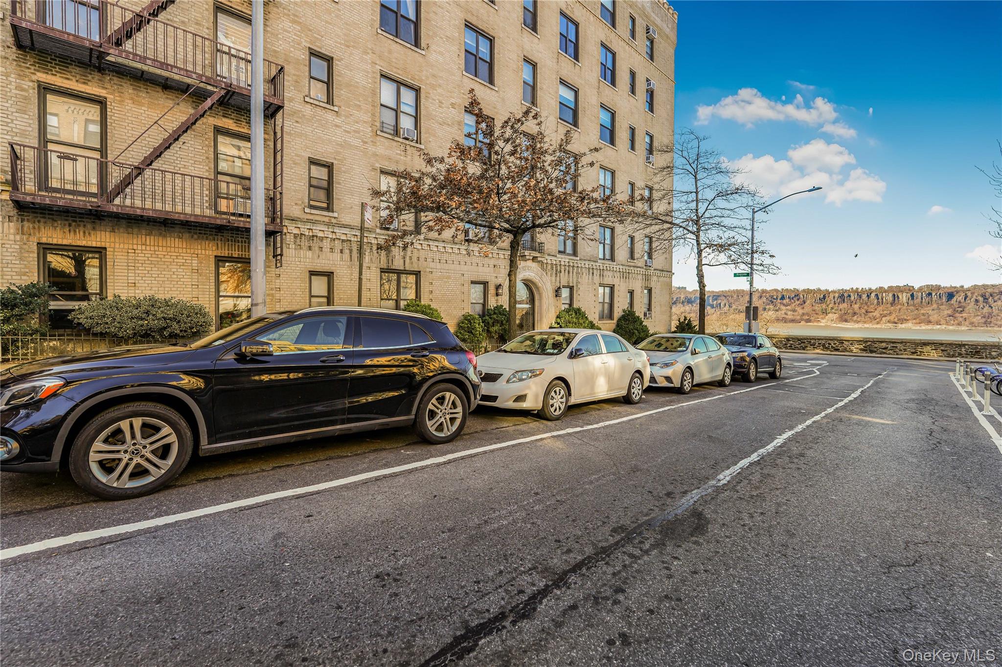 880 West 181st Street, Unit 6G Manhattan, NY 10033 - Photo 12 of 13 a view of a car parked in front of a building