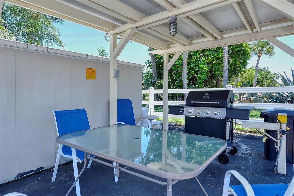 925 Beach Road, Unit 311 Sarasota, FL 34242 - Photo 38 of 53 a outdoor dining space with furniture and outdoor view