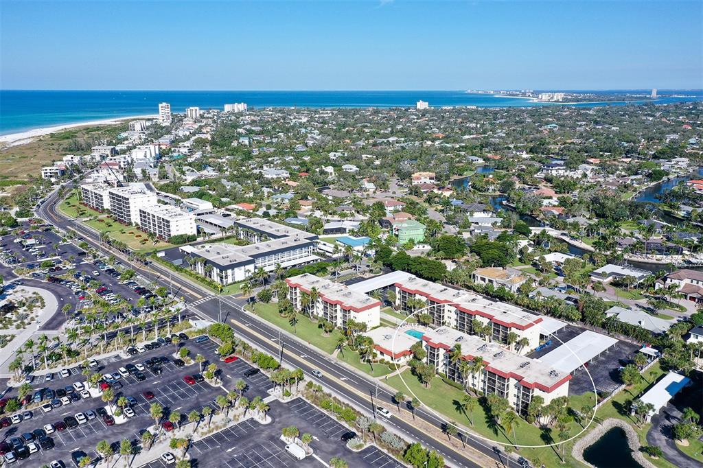 925 Beach Road, Unit 311 Sarasota, FL 34242 - Photo 53 of 53 an aerial view of residential building and ocean