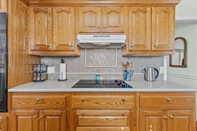 a kitchen with stainless steel appliances granite countertop a sink and cabinets