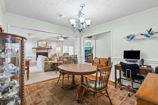 a view of a livingroom with furniture and a fireplace