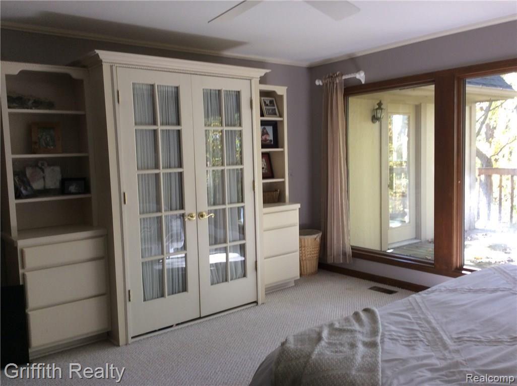 540 Timber Ridge Trail Howell, MI 48843 - Photo 26 of 60 Master bedroom with built-ins for storage, walk in closet and adjoins full spa bath.