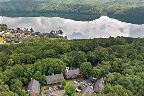 an aerial view of a house with a yard