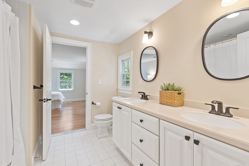 200 Nashoba Road Concord, MA 01742 - Photo 28 of 42 a bathroom with a granite countertop sink and a mirror