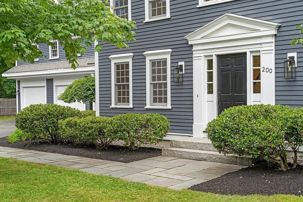 200 Nashoba Road Concord, MA 01742 - Photo 3 of 42 a front view of a house with garden