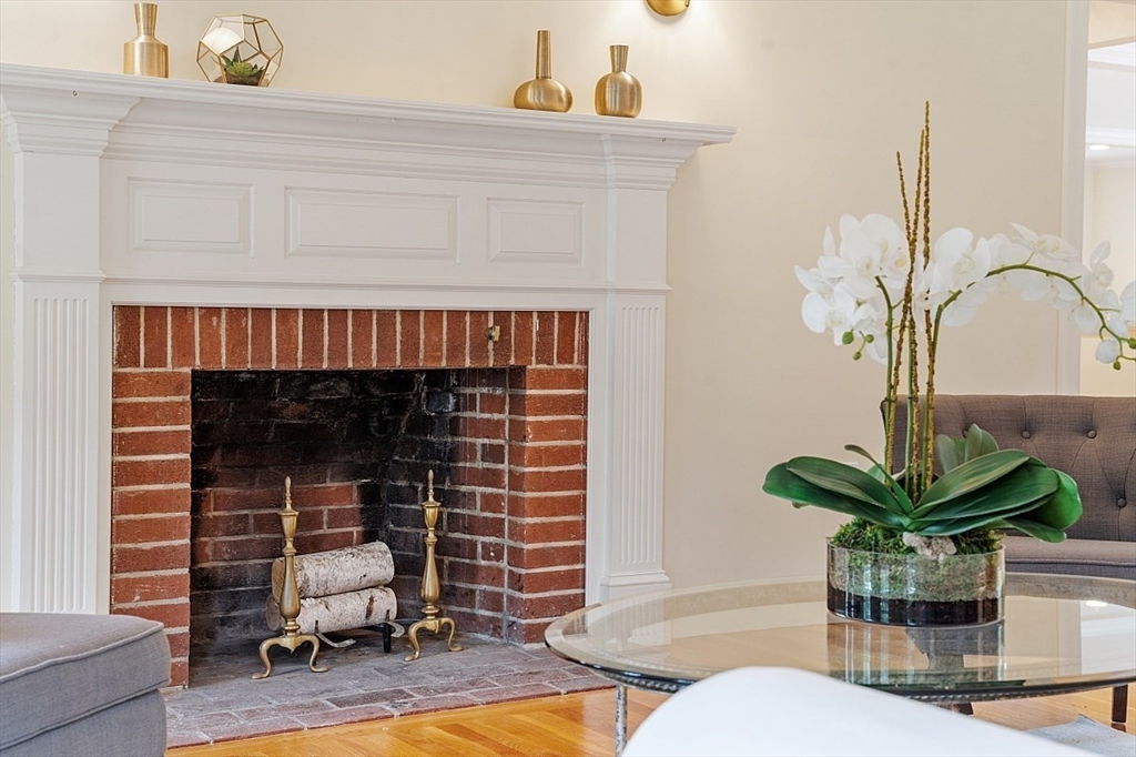 200 Nashoba Road Concord, MA 01742 - Photo 8 of 42 a living room with furniture a potted plant and a fireplace