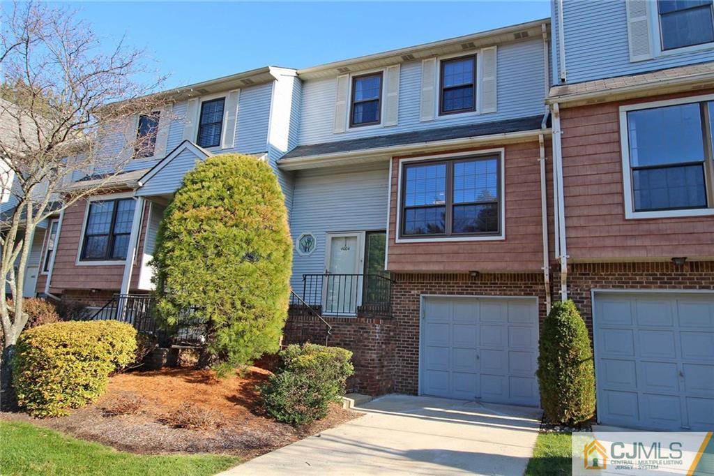 4004 Springbrook Drive Edison, NJ 08820 - Photo 2 of 25 a view of a brick house with large windows