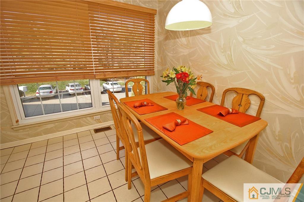 4004 Springbrook Drive Edison, NJ 08820 - Photo 12 of 25 a dining room with furniture and wooden floor