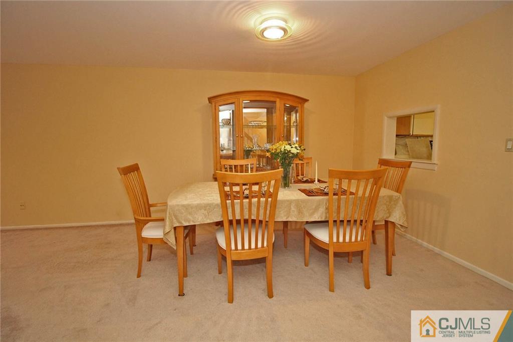 4004 Springbrook Drive Edison, NJ 08820 - Photo 7 of 25 a view of a dining room with furniture and wooden floor