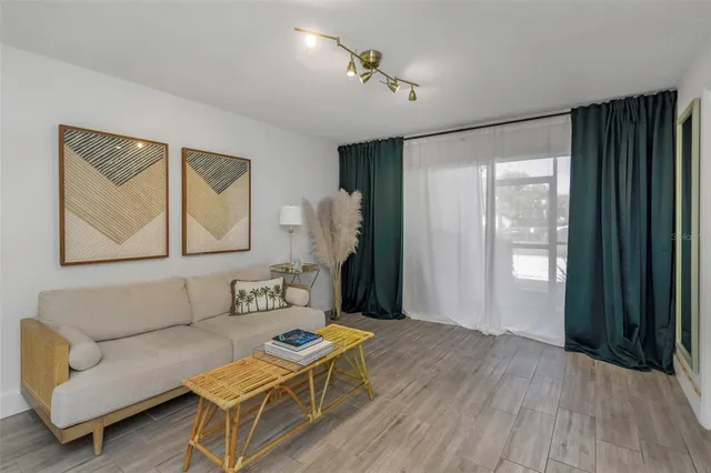 a living room with furniture and a window