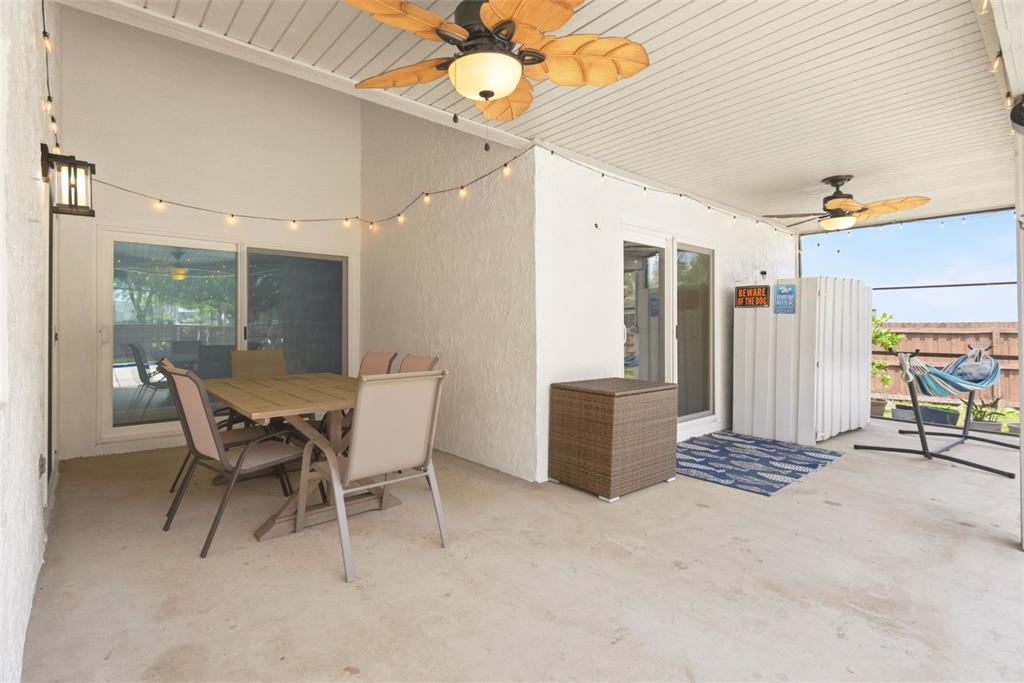 7432 Sparkling Lake Road Orlando, FL 32819 - Photo 31 of 54 a dining room with furniture and a window