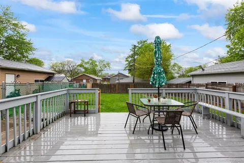 a view of a chairs and table on the deck