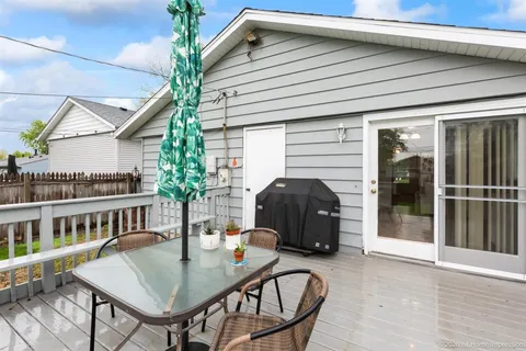 a house that has a couple of table and chairs in it