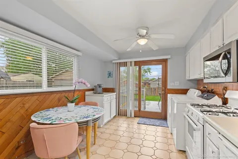 a kitchen with a stove a sink and a refrigerator