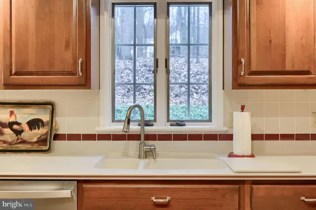 a kitchen that has a table chairs and wooden floor