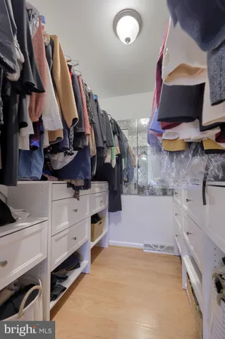 a view of a workspace with furniture and a gym equipment