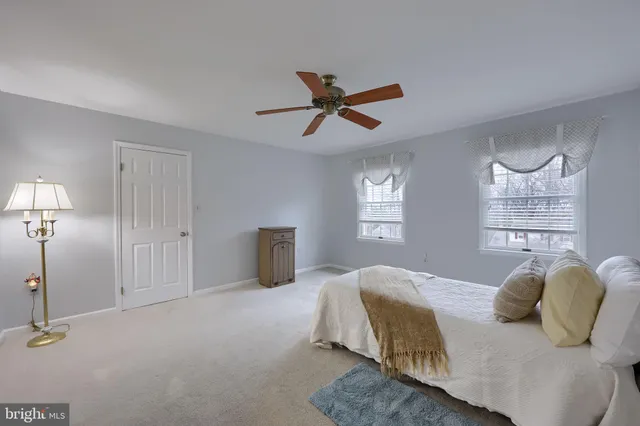 a view of a porch with chairs and backyard