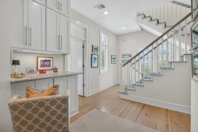 a bedroom with a bed and a chair in it