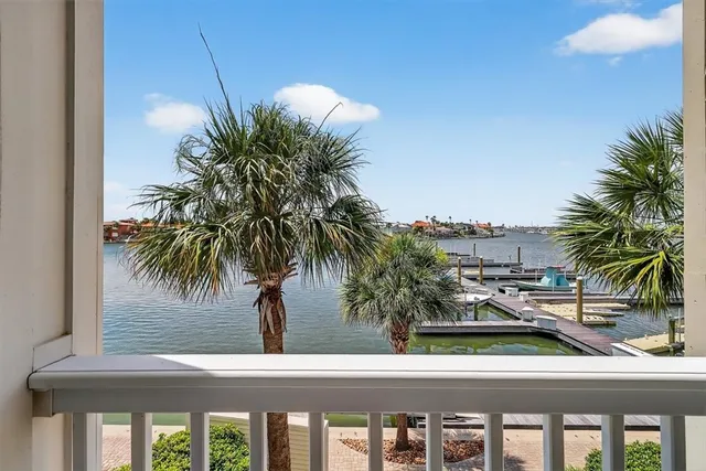 a bathroom with double vanity sink a mirror and a window