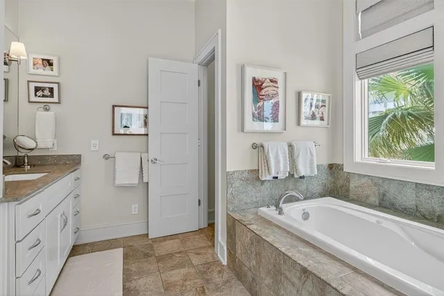 a bath tub sitting next to a window