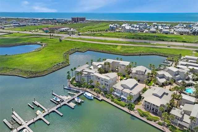 an aerial view of a house with a ocean view