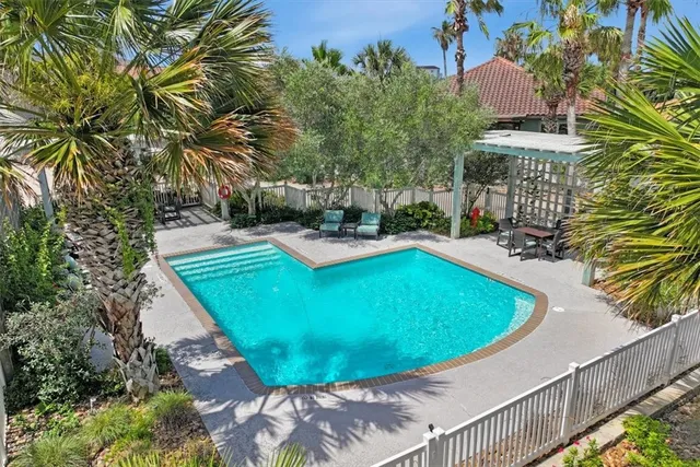 view of a balcony with two chairs