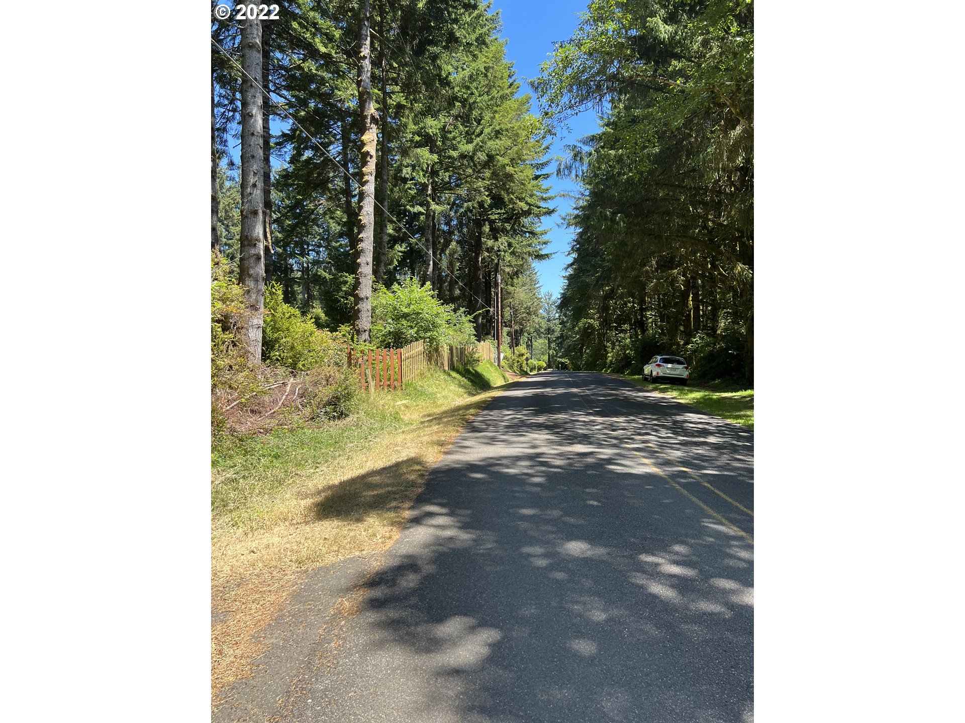 Boy Scout Road, Unit 2709 Florence, OR 97439 - Photo 5 of 5 a view of a yard with trees in the background