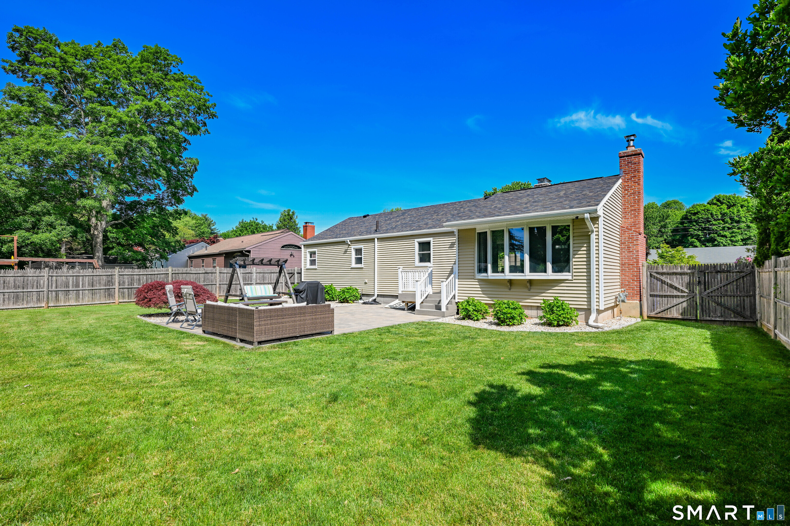 87 Lydall Road Newington, CT 06111 - Photo 27 of 35 a view of a house with a backyard and a patio