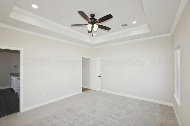 an a glass room with ceiling fan