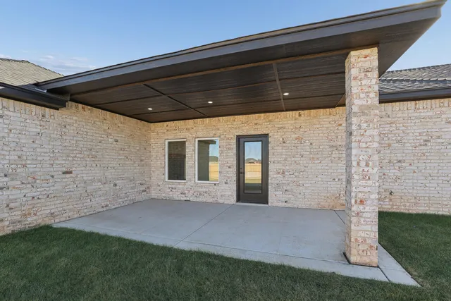 a view of house with backyard