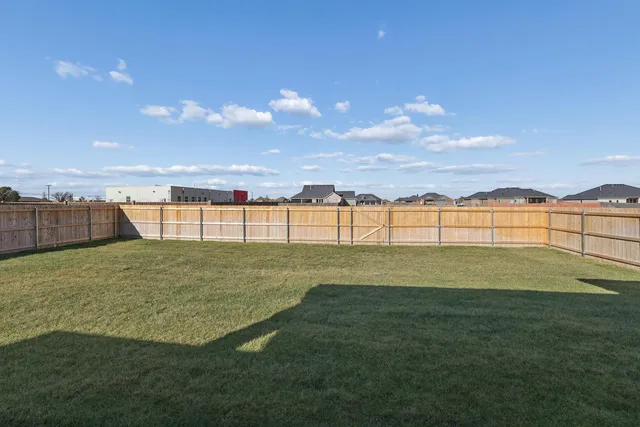a view of a golf course with a lake view