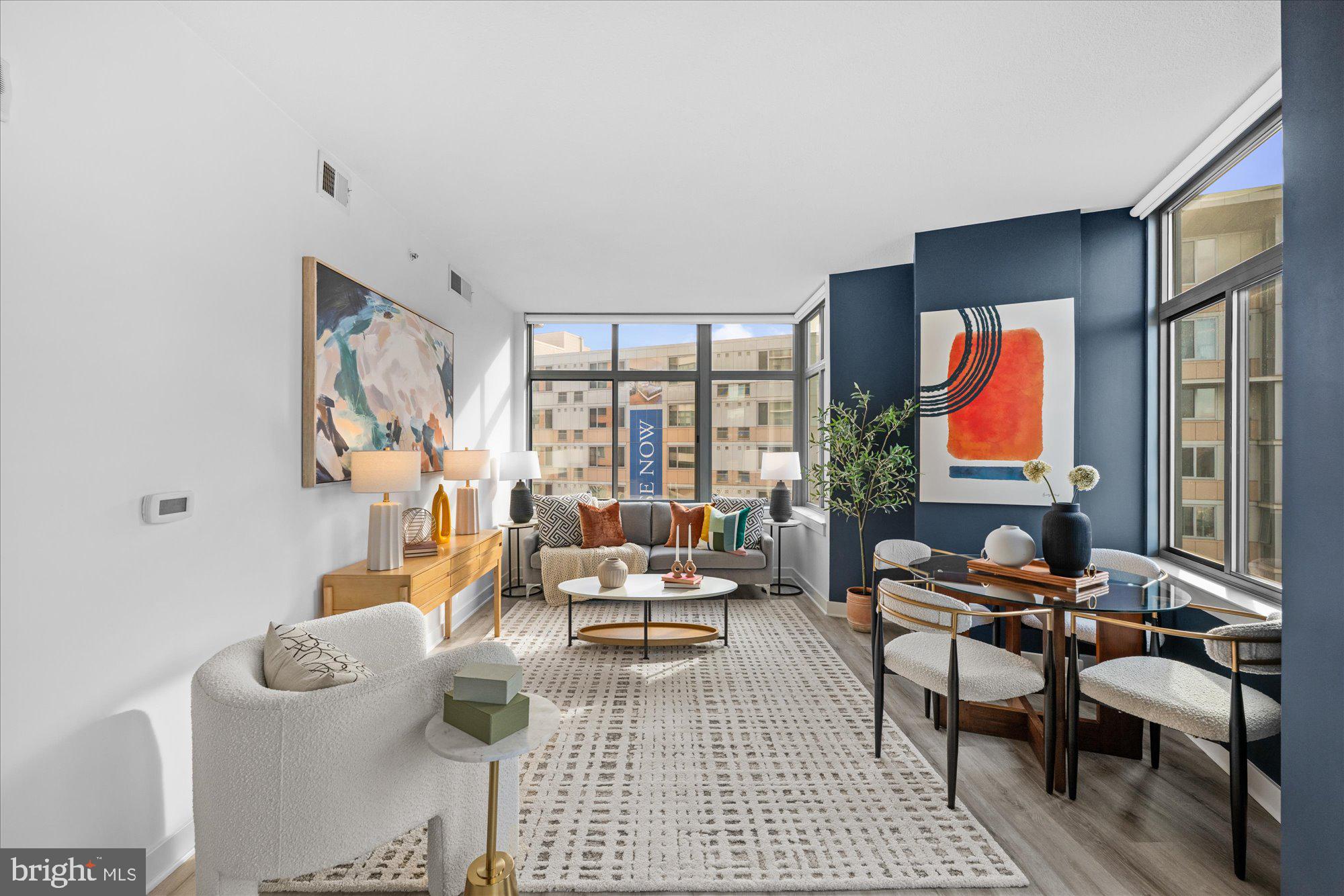 460 New York Avenue Northwest, Unit 504 Washington, DC 20001 - Photo 13 of 62 a living room with furniture and a window