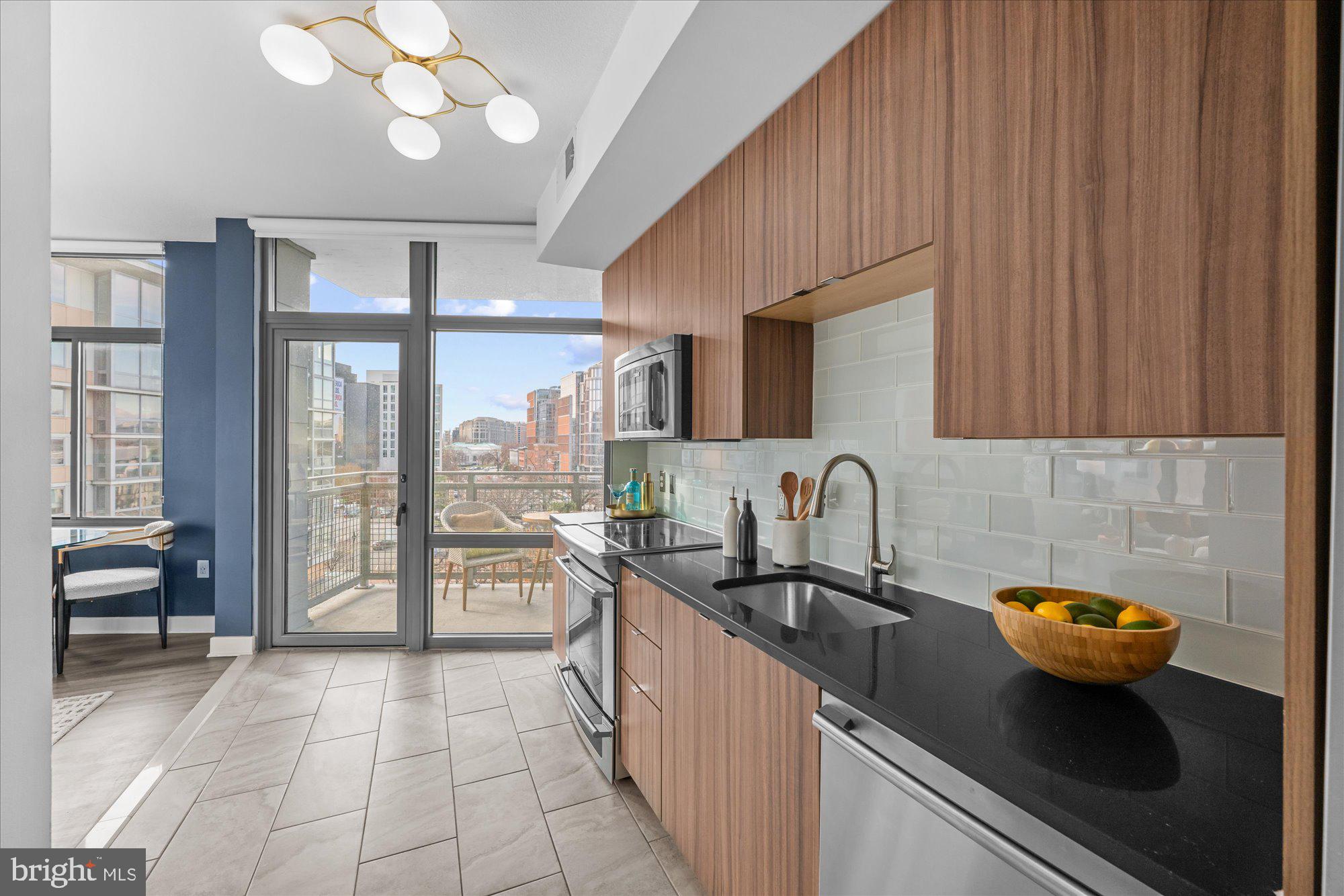 460 New York Avenue Northwest, Unit 504 Washington, DC 20001 - Photo 16 of 62 a kitchen with a sink and cabinets