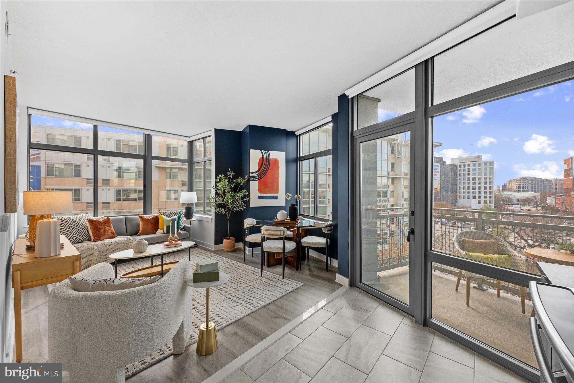 460 New York Avenue Northwest, Unit 504 Washington, DC 20001 - Photo 17 of 62 a living room with furniture a large window and chandelier
