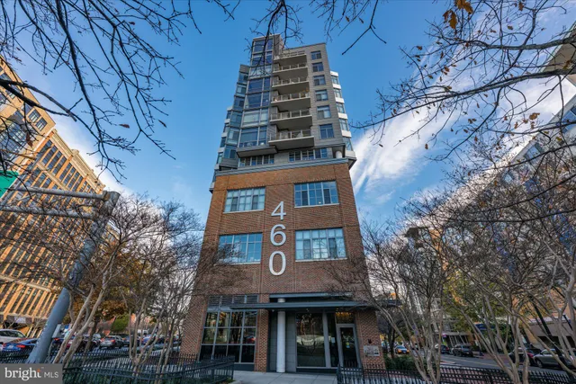a city street lined with buildings and cars