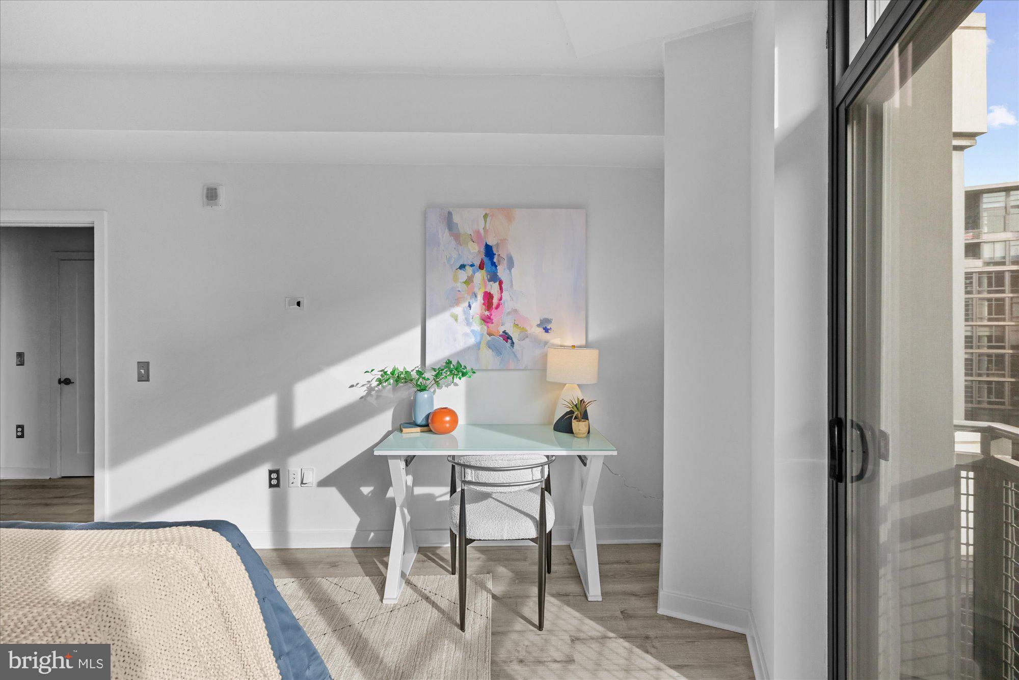 460 New York Avenue Northwest, Unit 504 Washington, DC 20001 - Photo 25 of 62 a dining room with furniture and wooden floor