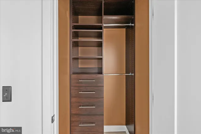 a view of an entryway with wooden floor