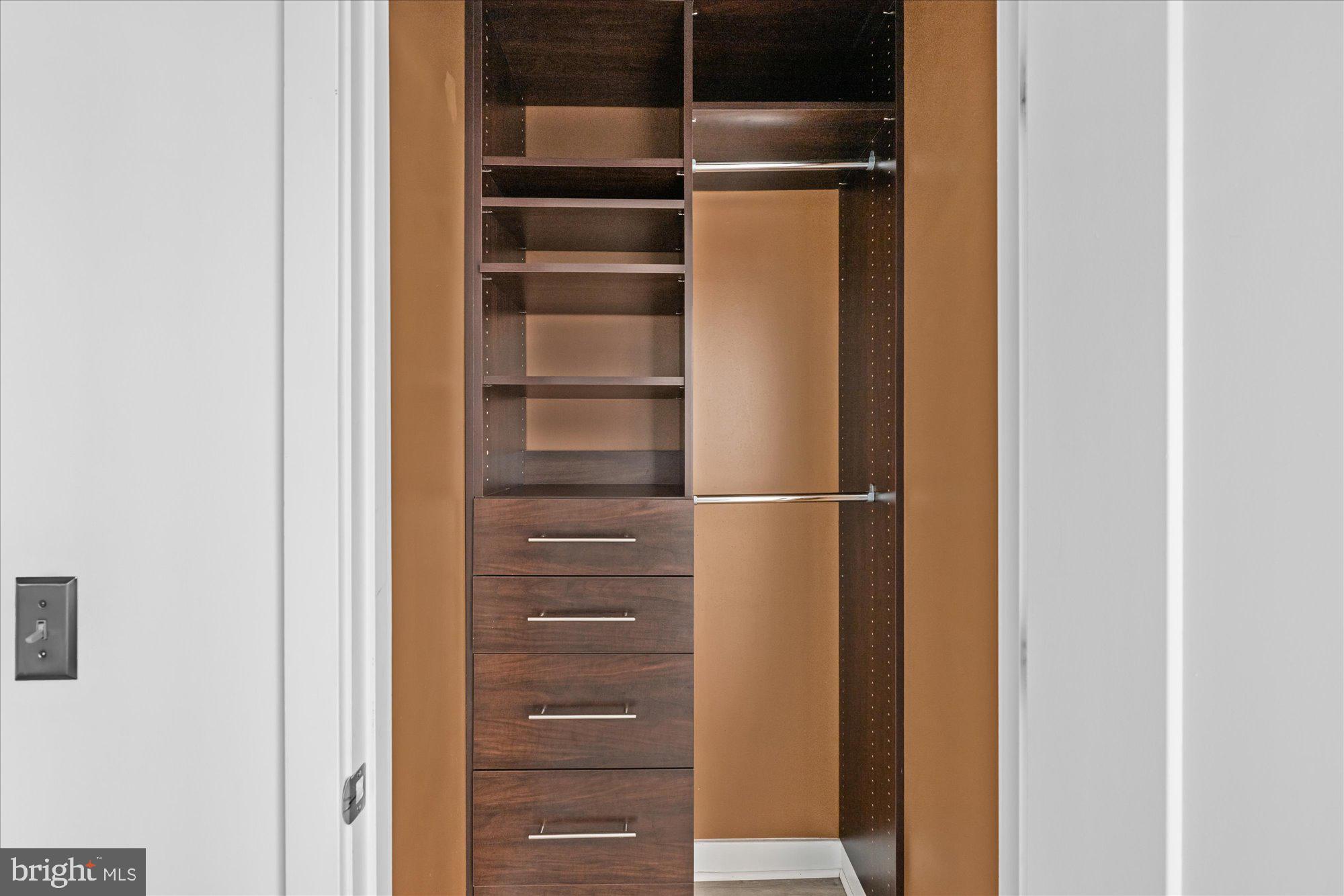 460 New York Avenue Northwest, Unit 504 Washington, DC 20001 - Photo 30 of 62 a view of walk in closet with empty racks