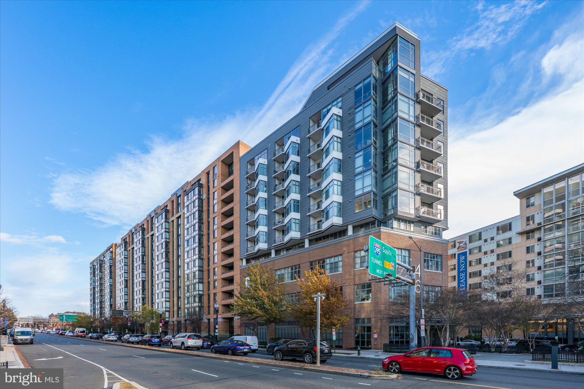 460 New York Avenue Northwest, Unit 504 Washington, DC 20001 - Photo 3 of 62 a city street lined with buildings and cars