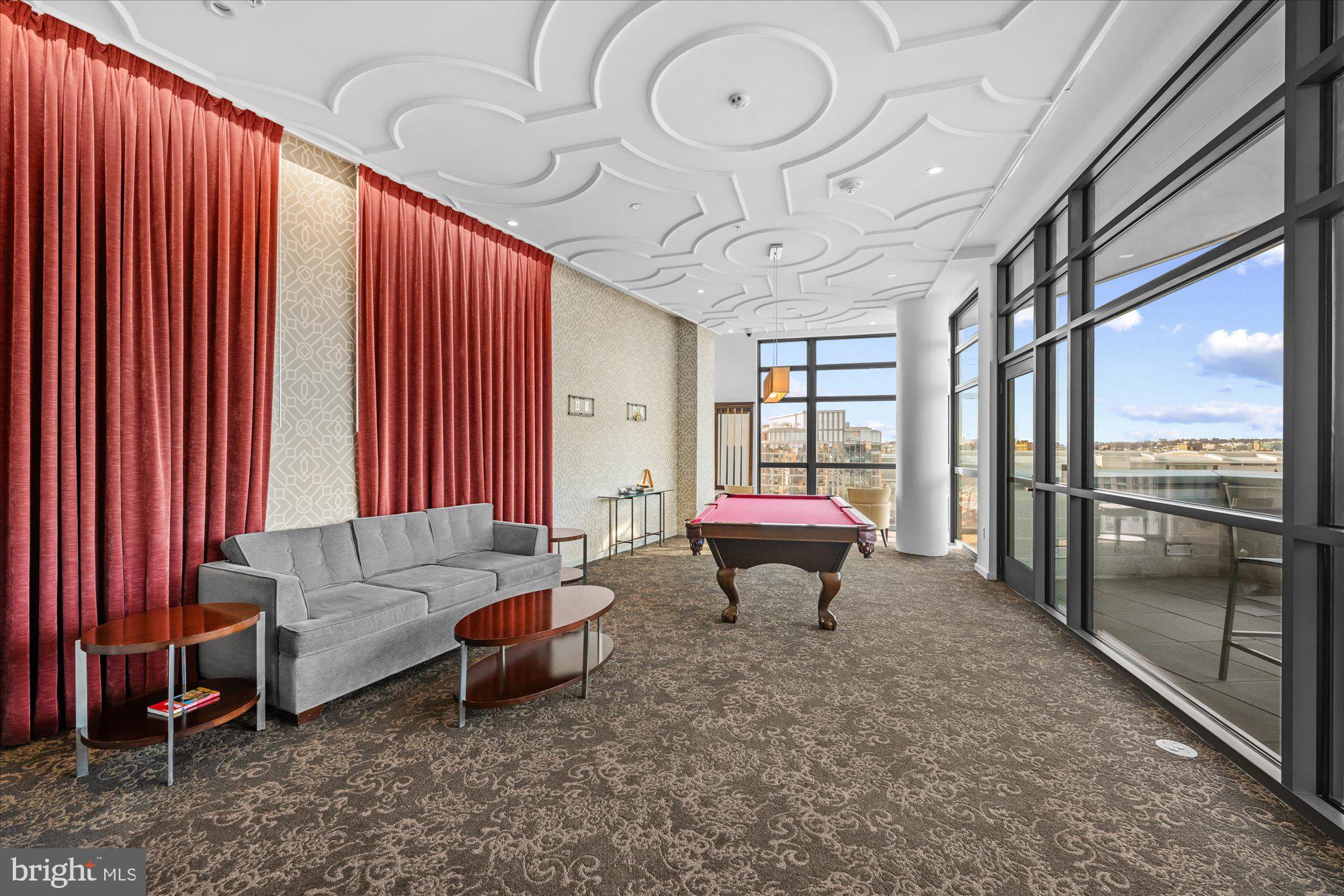 460 New York Avenue Northwest, Unit 504 Washington, DC 20001 - Photo 32 of 62 a living room with furniture a table and chairs
