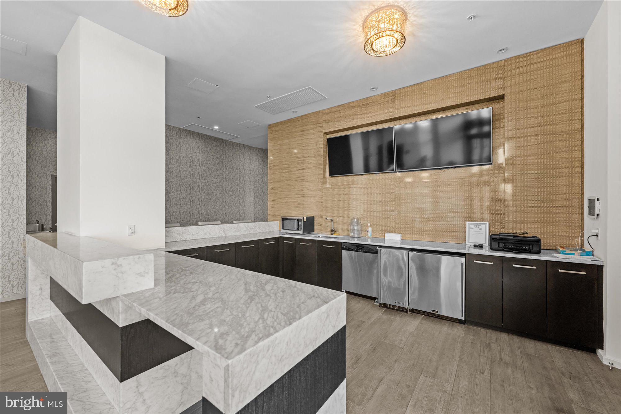 460 New York Avenue Northwest, Unit 504 Washington, DC 20001 - Photo 36 of 62 a kitchen with granite countertop a sink and a stove top oven