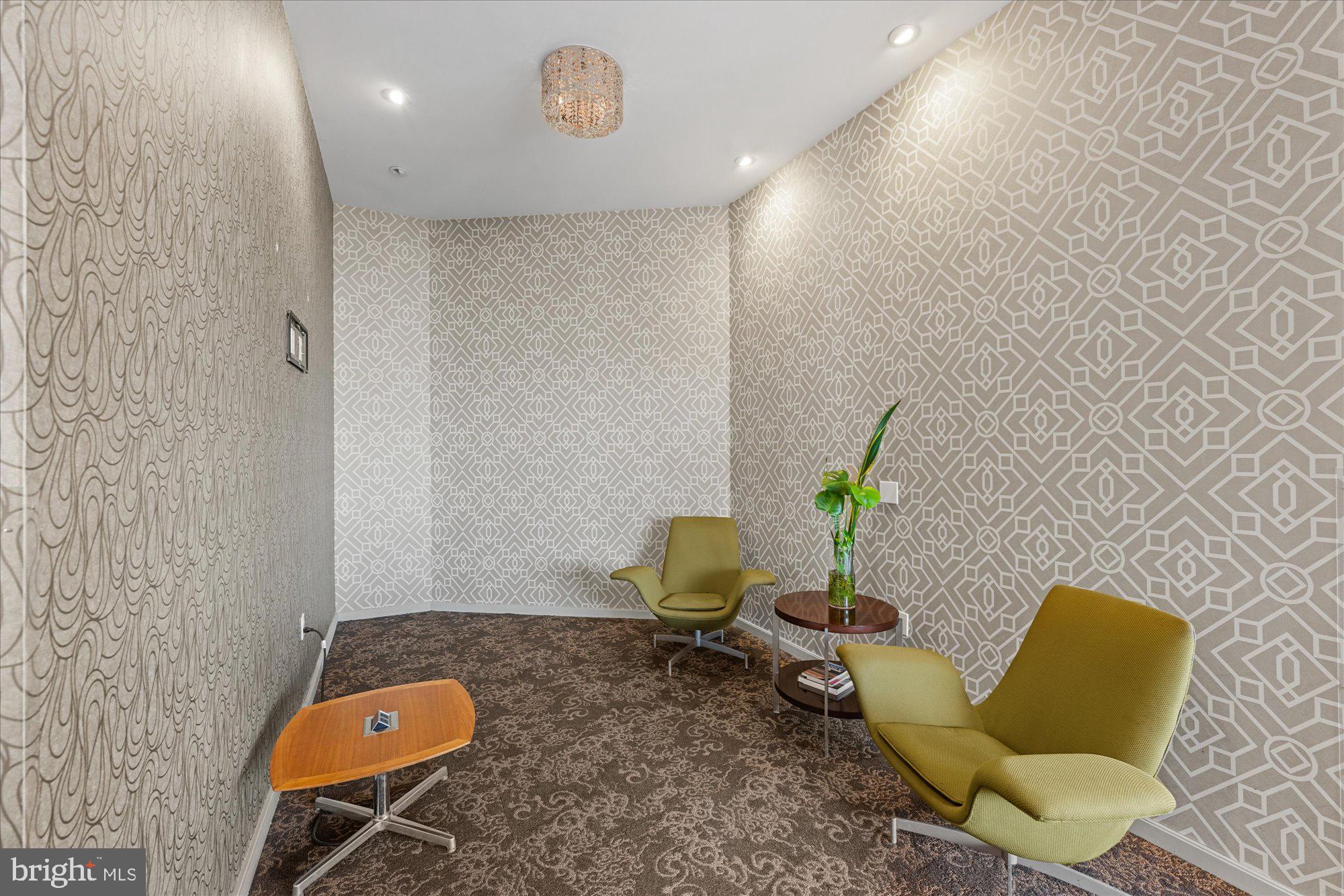 460 New York Avenue Northwest, Unit 504 Washington, DC 20001 - Photo 38 of 62 a living room with furniture and a potted plant