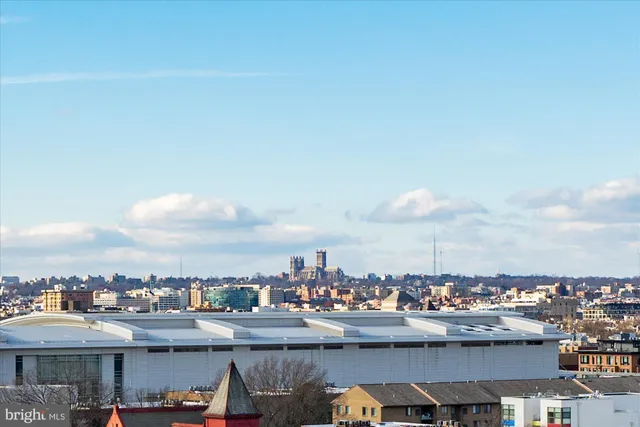 a building with lots of green space