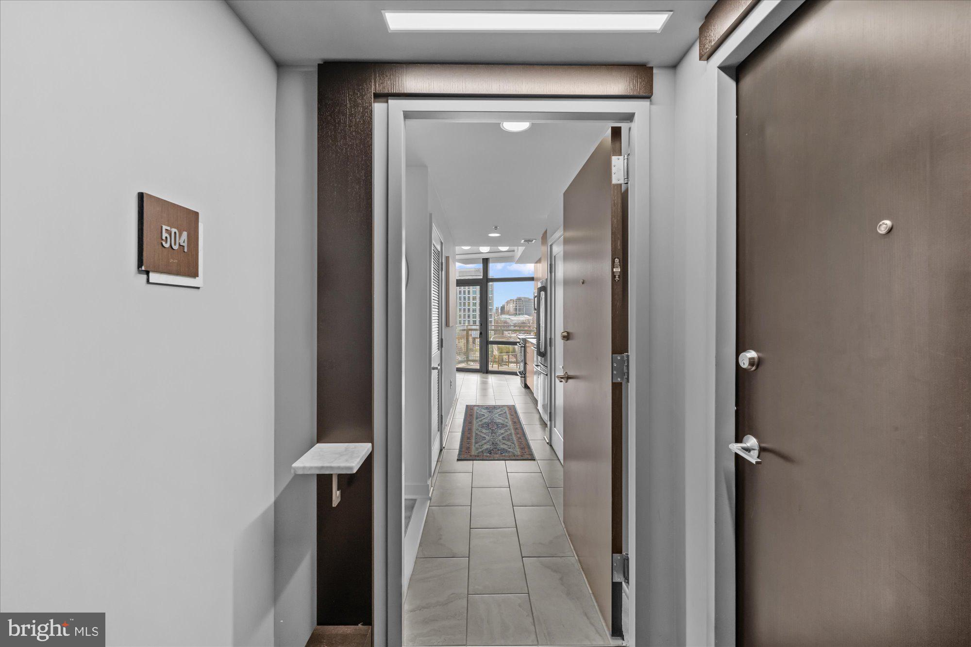 460 New York Avenue Northwest, Unit 504 Washington, DC 20001 - Photo 8 of 62 a view of a hallway view with wooden floor and a bathroom
