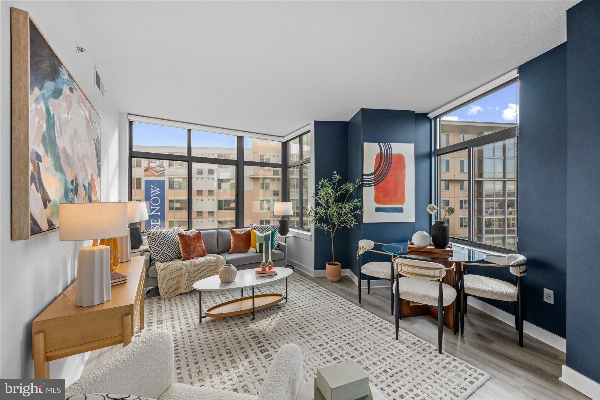 460 New York Avenue Northwest, Unit 504 Washington, DC 20001 - Photo 9 of 62 a living room with furniture and a large window