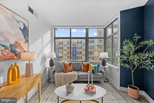 a living room with furniture and a window