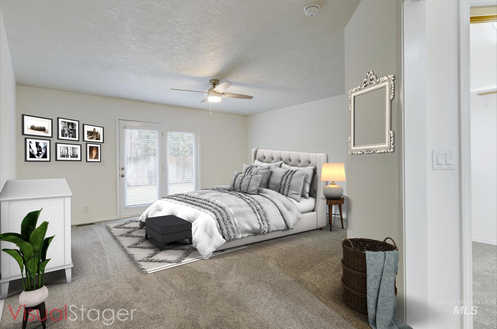 1168 North Pinnacle Way Eagle, ID 83616 - Photo 18 of 32 Carpeted bedroom with a textured ceiling, a ceiling fan, and access to outside