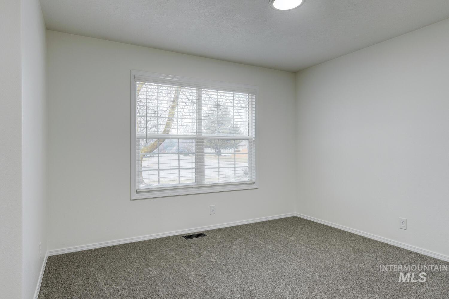 1168 North Pinnacle Way Eagle, ID 83616 - Photo 27 of 32 Spare room with baseboards and carpet floors