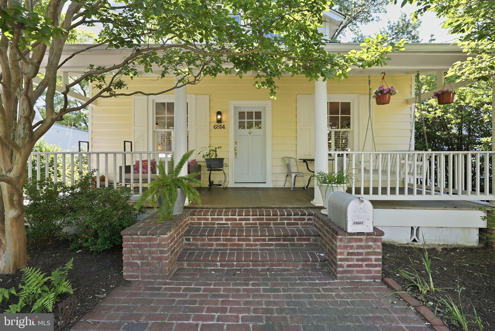 6814 Brookville Road Chevy Chase, MD 20815 - Photo 2 of 39 Charming yellow home with inviting porch.